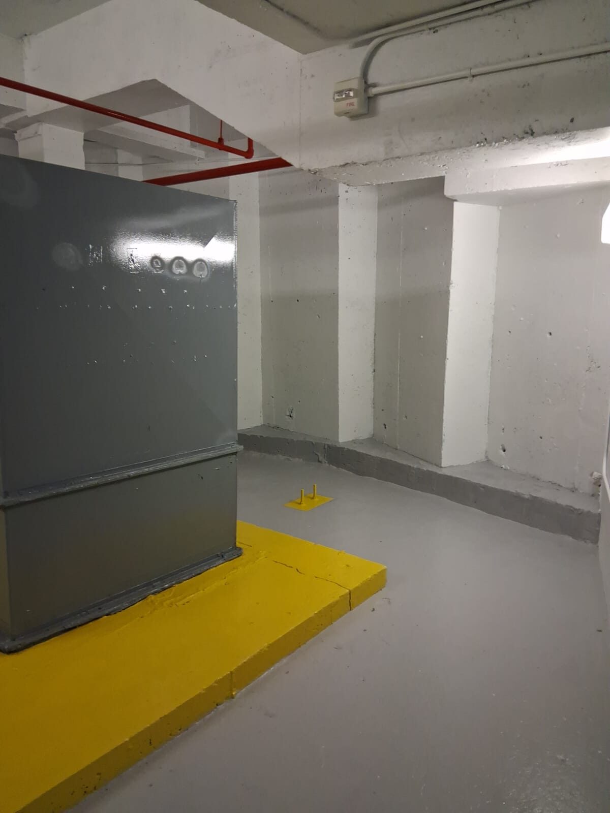 Clean facility interior with epoxy floor and safety striping