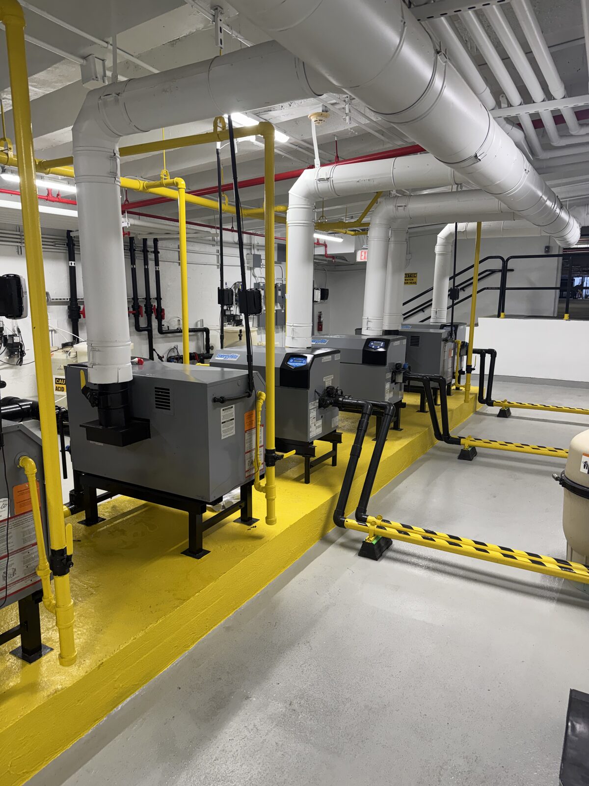 Pump and water treatment room with safety striping